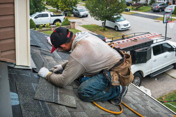 Professional Roofing technician working in Raynham Center, MA